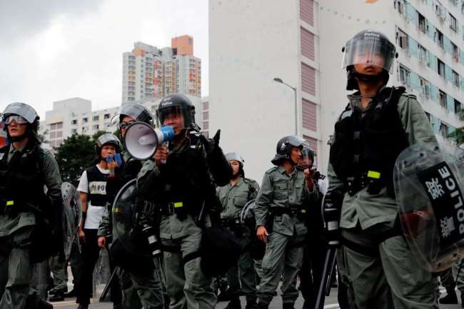 Action continues against supporters of democracy in Hong Kong, police search for six including activist Nathan